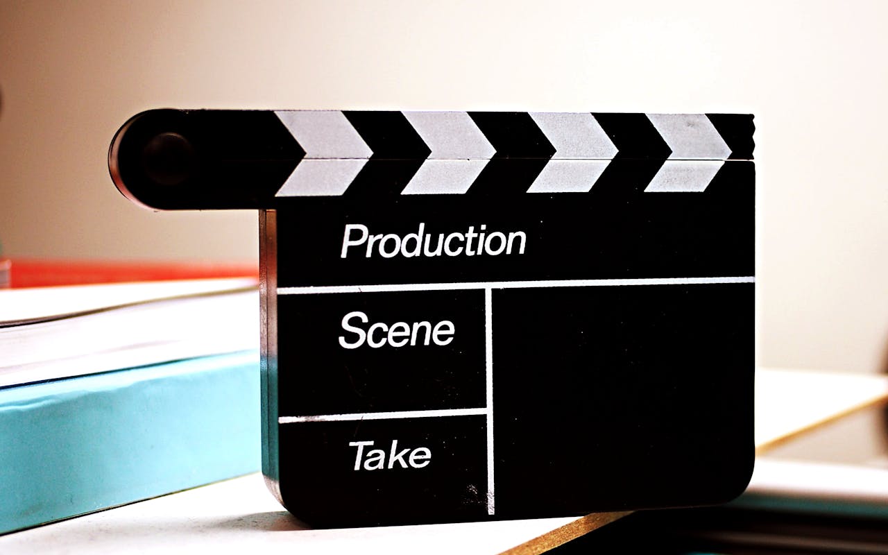 services-01 Close-up of a film clapperboard on a desk, ideal for media and production themes.